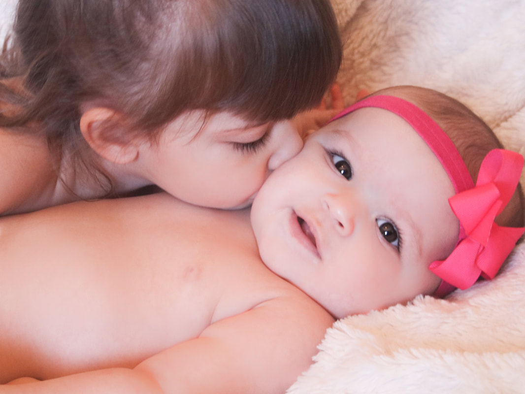 Newborn with teddy bear